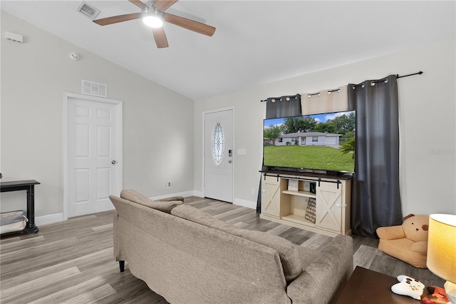 18 Banyan Pass, Ocala, FL 34472 - living area with light wood-style floors, ceiling fan, baseboards, vaulted ceiling, and plenty of natural light