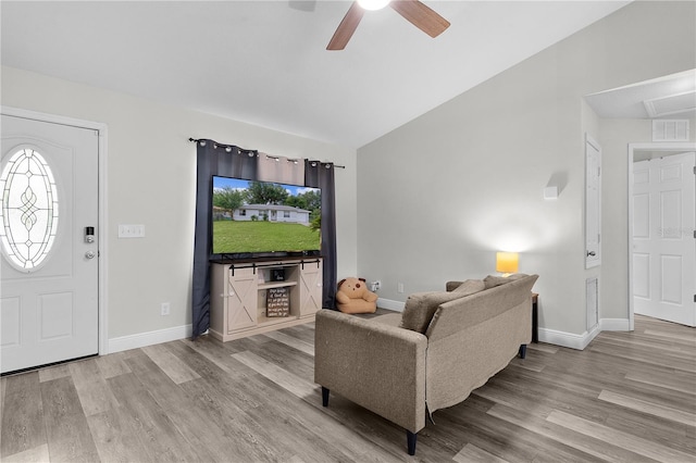 18 Banyan Pass, Ocala, FL 34472 - living area with wood finished floors, lofted ceiling, ceiling fan, and baseboards