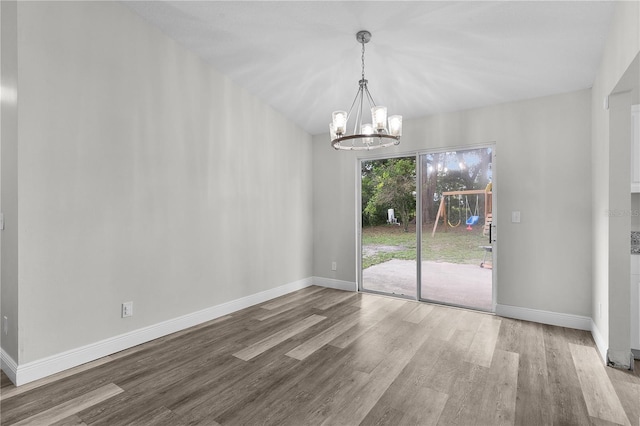 18 Banyan Pass, Ocala, FL 34472 - unfurnished dining area with wood finished floors, a chandelier, and baseboards