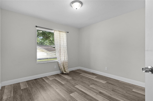 18 Banyan Pass, Ocala, FL 34472 - unfurnished room with wood finished floors and baseboards