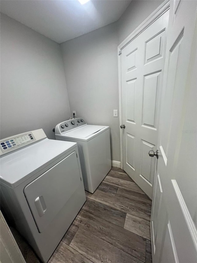 18 Banyan Pass, Ocala, FL 34472 - laundry area featuring washer and clothes dryer and dark wood-style flooring