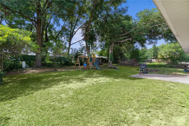 18 Banyan Pass, Ocala, FL 34472 - view of yard featuring a playground and a patio area