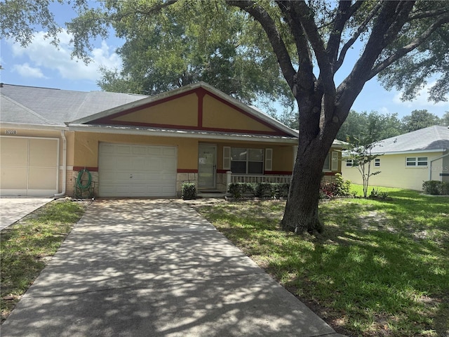 9722 SW 95th Ct Unit C, Ocala, FL 34481 - view of front of home featuring a porch, a garage, concrete driveway, a front yard, and brick siding