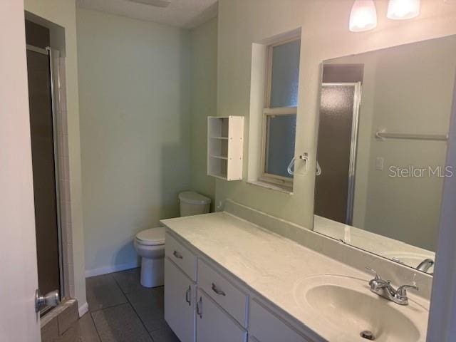 9722 SW 95th Ct Unit C, Ocala, FL 34481 - bathroom featuring a stall shower, tile patterned flooring, and vanity