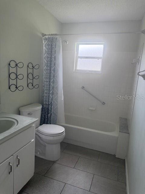 9722 SW 95th Ct Unit C, Ocala, FL 34481 - full bath featuring vanity, shower / bath combo with shower curtain, tile patterned floors, and a textured ceiling