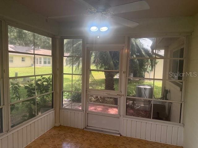 9722 SW 95th Ct Unit C, Ocala, FL 34481 - unfurnished sunroom featuring ceiling fan
