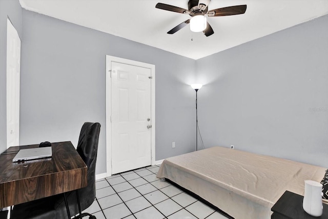 6816 Thomas Cir, Tampa, FL 33619 - bedroom with light tile patterned floors and ceiling fan