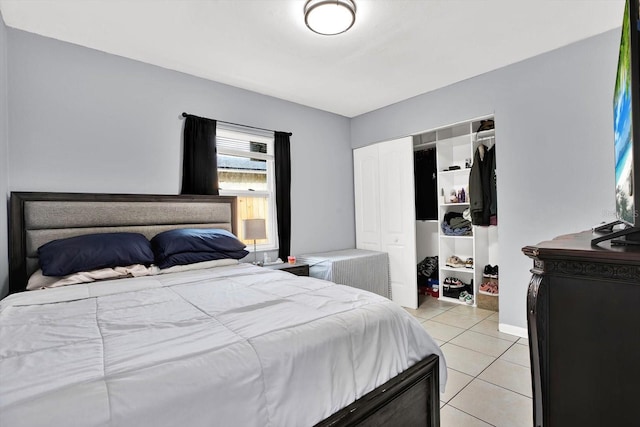 6816 Thomas Cir, Tampa, FL 33619 - bedroom with light tile patterned flooring and a closet