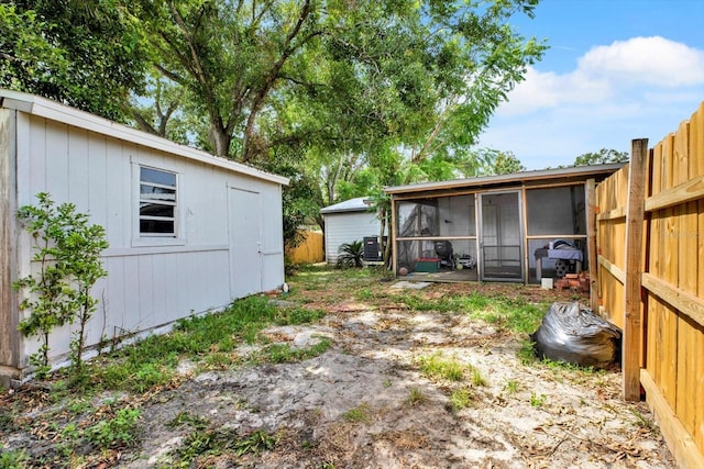 6816 Thomas Cir, Tampa, FL 33619 - view of yard featuring a sunroom