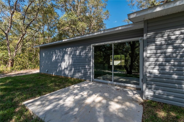 16615 SE 63rd Ln, Ocklawaha, FL 32179 - view of home's exterior featuring a patio area