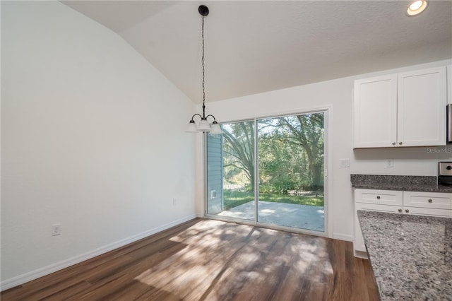 16615 SE 63rd Ln, Ocklawaha, FL 32179 - unfurnished dining area with dark wood finished floors, a chandelier, and vaulted ceiling