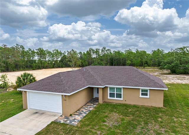 5331 SW 121st Ter, Ocala, FL 34481 - single story home with stucco siding, driveway, and an attached garage