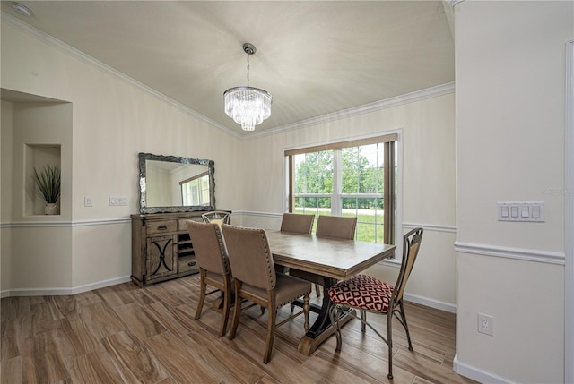 5331 SW 121st Ter, Ocala, FL 34481 - dining space featuring crown molding, a chandelier, and wood finished floors