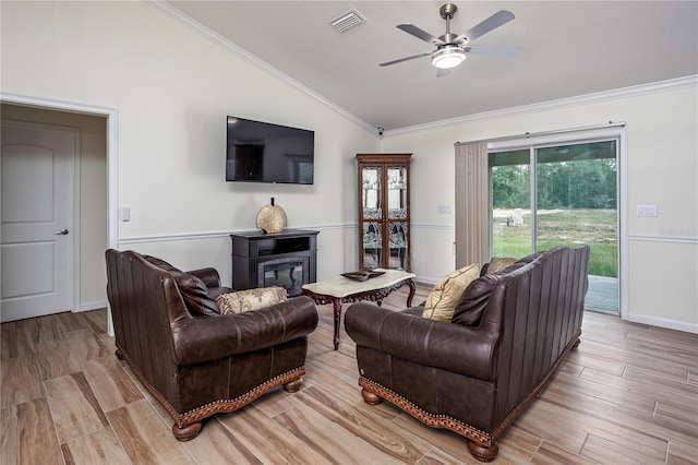 5331 SW 121st Ter, Ocala, FL 34481 - living area featuring lofted ceiling, ceiling fan, crown molding, light wood-type flooring, and a glass covered fireplace