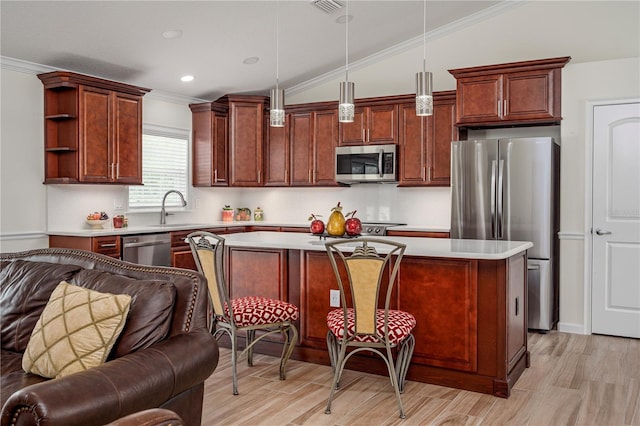 5331 SW 121st Ter, Ocala, FL 34481 - kitchen featuring stainless steel appliances, open floor plan, light countertops, ornamental molding, and a center island