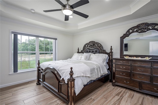 5331 SW 121st Ter, Ocala, FL 34481 - bedroom with a tray ceiling, light wood-style flooring, crown molding, and ceiling fan
