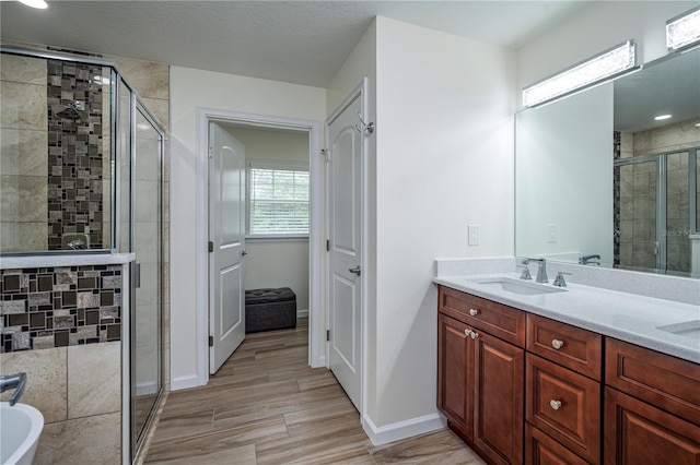 5331 SW 121st Ter, Ocala, FL 34481 - full bath with a shower stall, double vanity, wood finished floors, and a tub to relax in