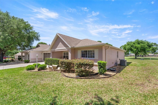 9735 SW 96th St, Ocala, FL 34481 - view of front of home with a garage, stucco siding, a front yard, and concrete driveway