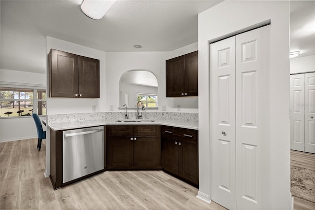9735 SW 96th St, Ocala, FL 34481 - kitchen with dishwasher, light wood-style floors, and dark brown cabinetry