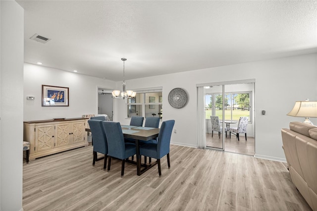 9735 SW 96th St, Ocala, FL 34481 - dining room with a chandelier, light wood-type flooring, and recessed lighting