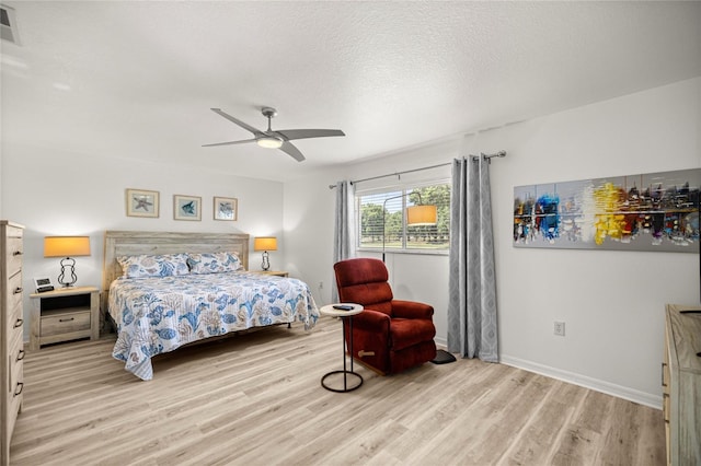 9735 SW 96th St, Ocala, FL 34481 - bedroom featuring wood finished floors, a ceiling fan, and a textured ceiling