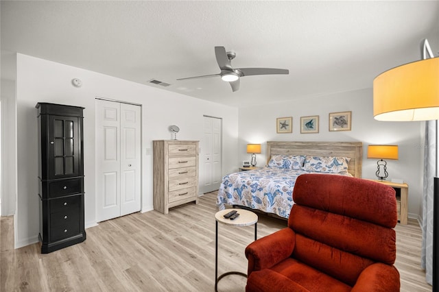9735 SW 96th St, Ocala, FL 34481 - bedroom with two closets, light wood-style floors, and ceiling fan