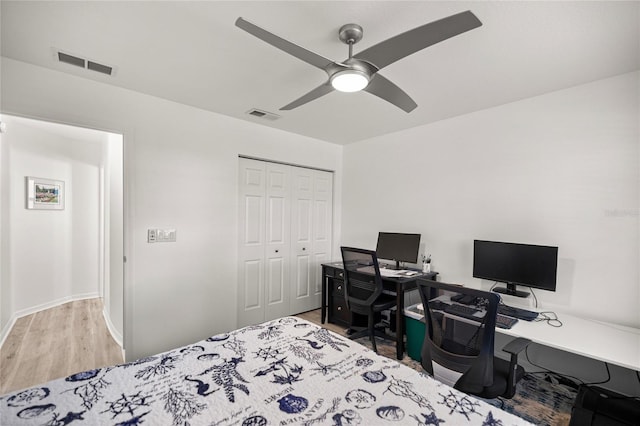 9735 SW 96th St, Ocala, FL 34481 - bedroom featuring wood finished floors, a closet, an office area, and ceiling fan