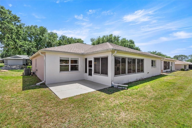 9735 SW 96th St, Ocala, FL 34481 - rear view of property with a patio, a yard, and stucco siding