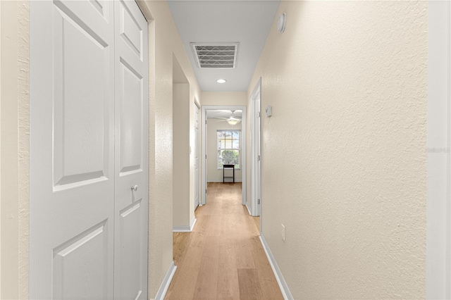 8034 SW 81st Loop, Ocala, FL 34476 - hall with a textured wall, light wood-style flooring, and recessed lighting