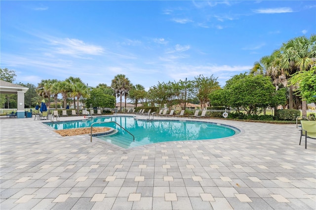 8034 SW 81st Loop, Ocala, FL 34476 - community pool featuring a patio