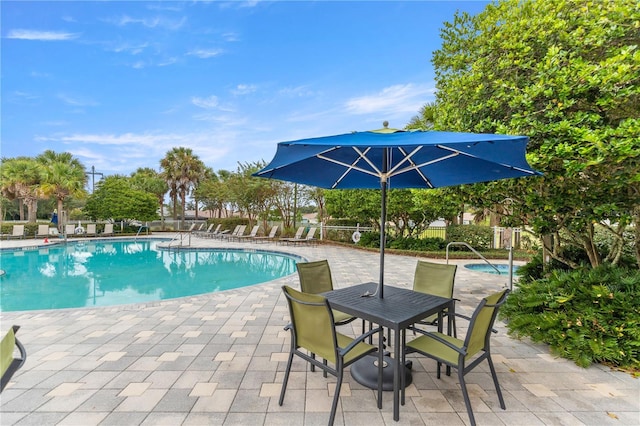 8034 SW 81st Loop, Ocala, FL 34476 - community pool featuring a patio area
