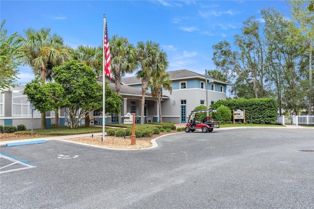 8034 SW 81st Loop, Ocala, FL 34476 - view of front of home with uncovered parking and stucco siding