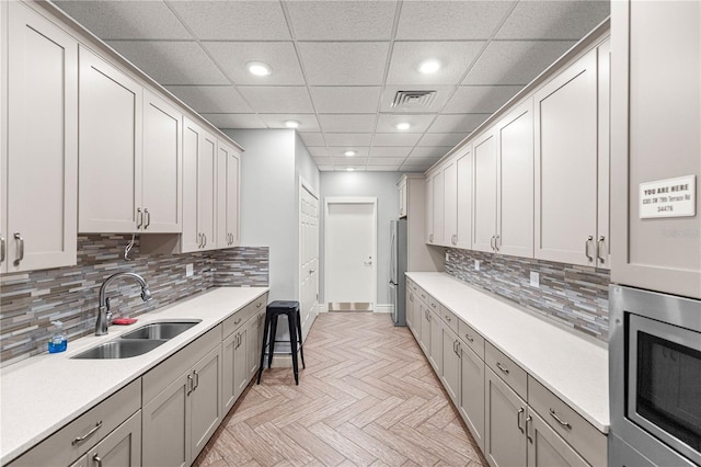 8034 SW 81st Loop, Ocala, FL 34476 - kitchen featuring stainless steel appliances, recessed lighting, light countertops, decorative backsplash, and gray cabinetry