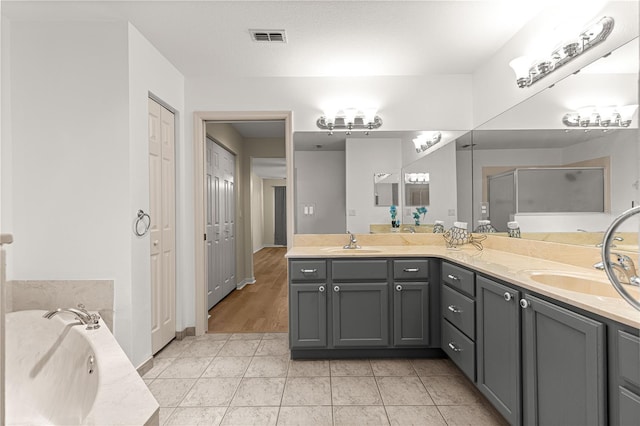 8034 SW 81st Loop, Ocala, FL 34476 - full bath with double vanity, a shower stall, a bath, and a closet