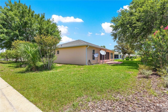 8034 SW 81st Loop, Ocala, FL 34476 - view of side of property featuring stucco siding and a lawn