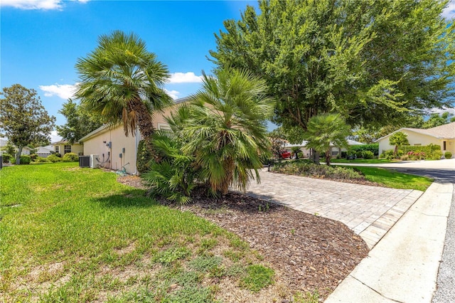 8034 SW 81st Loop, Ocala, FL 34476 - view of grassy yard featuring decorative driveway