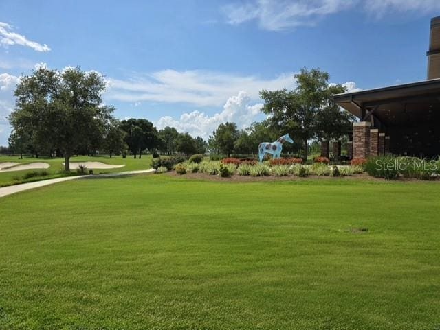 4232 NW 56th Ct, Ocala, FL 34482 - view of home's community with a lawn