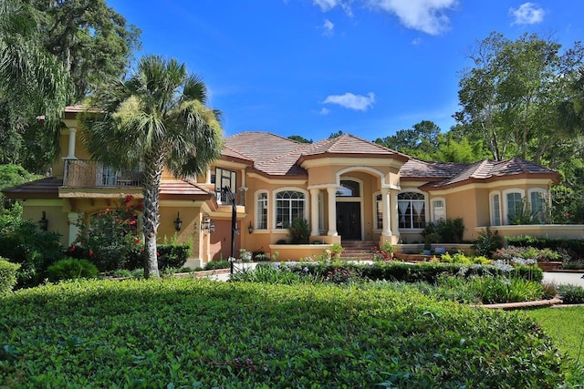 695 SE 47th Loop, Ocala, FL 34480 - mediterranean / spanish-style home featuring stucco siding and a tiled roof