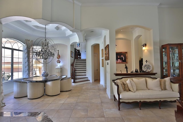 695 SE 47th Loop, Ocala, FL 34480 - foyer with ornamental molding, a chandelier, light tile patterned floors, and stairway
