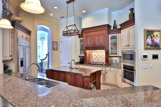 695 SE 47th Loop, Ocala, FL 34480 - kitchen featuring built in appliances, cream cabinets, dark stone countertops, glass insert cabinets, and tasteful backsplash