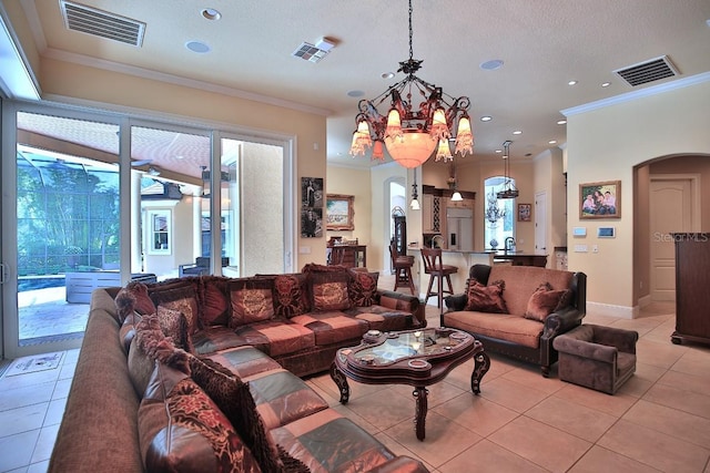 695 SE 47th Loop, Ocala, FL 34480 - living room with arched walkways, light tile patterned flooring, plenty of natural light, a chandelier, and ornamental molding