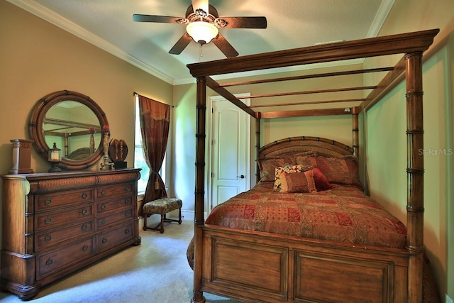 695 SE 47th Loop, Ocala, FL 34480 - bedroom with light carpet, ornamental molding, and a ceiling fan