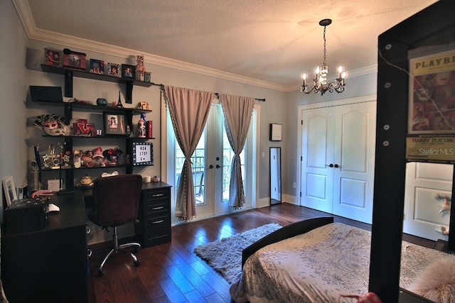 695 SE 47th Loop, Ocala, FL 34480 - bedroom featuring a chandelier, dark wood-style flooring, ornamental molding, a desk, and access to exterior