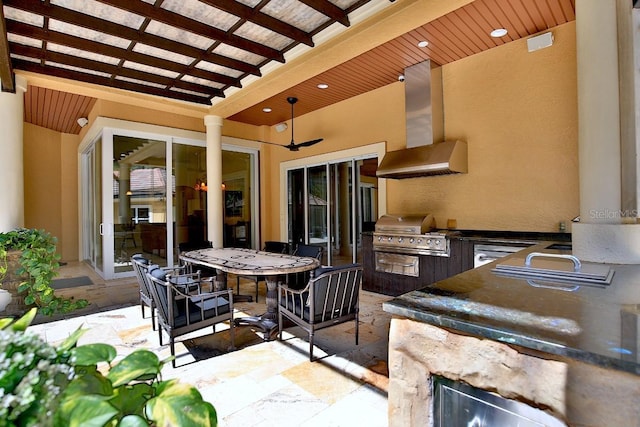 695 SE 47th Loop, Ocala, FL 34480 - view of patio featuring an outdoor kitchen, ceiling fan, and outdoor dining space