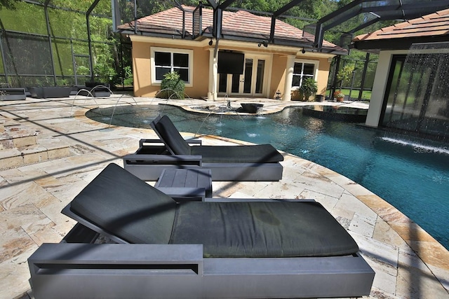 695 SE 47th Loop, Ocala, FL 34480 - view of pool with french doors, a lanai, a pool with connected hot tub, and a patio area