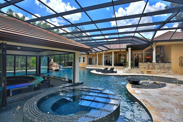695 SE 47th Loop, Ocala, FL 34480 - view of swimming pool with a pool with connected hot tub, a patio, and glass enclosure
