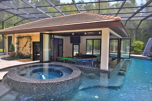 695 SE 47th Loop, Ocala, FL 34480 - view of pool featuring a lanai, a pool with connected hot tub, and a patio area
