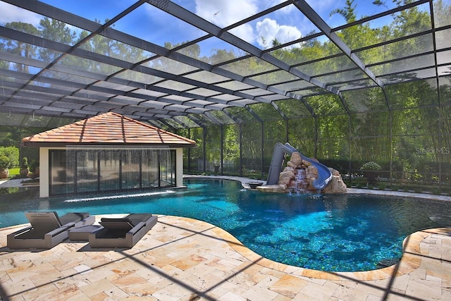 695 SE 47th Loop, Ocala, FL 34480 - outdoor pool with a water slide, a patio, and a lanai