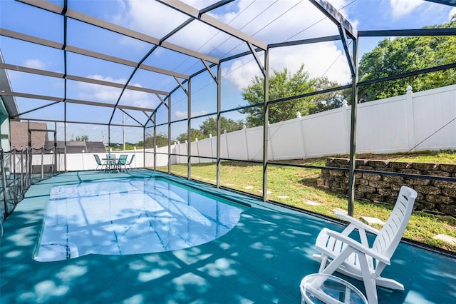 1584 Silhouette Dr, Clermont, FL 34711 - view of swimming pool with glass enclosure and a patio area
