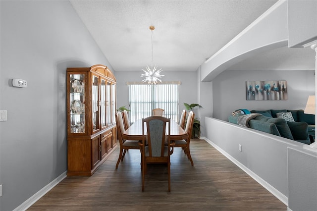 1584 Silhouette Dr, Clermont, FL 34711 - dining area with dark wood-type flooring, arched walkways, and a textured ceiling